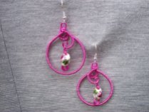 A pair of pink earrings.