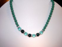 A oresent for a friend. She chose the small green beads and I worked around them. I do like the result.